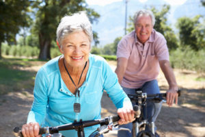 SP woman and man bike riding with MPERS